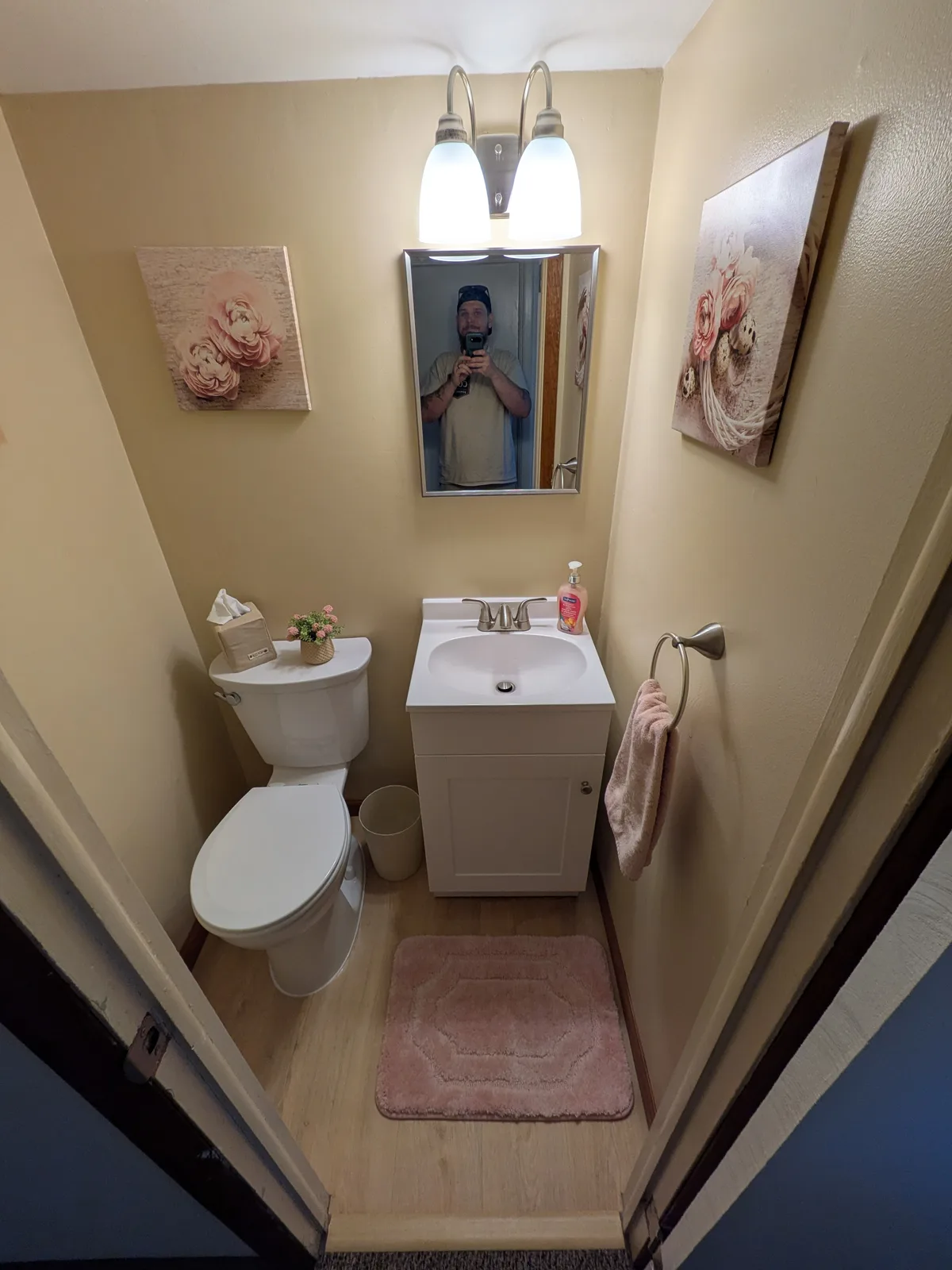 Powder room lighting and mirror after the remodel